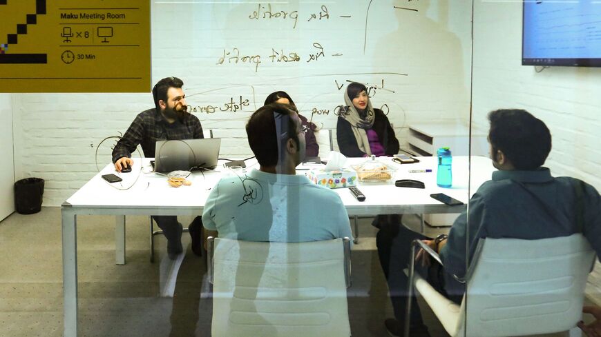 Employees work at headquarters housing Alibaba, Iran's largest online travel booking service, in the capital Tehran on February 17, 2020 - Iran's startup sector, which began to develop in the 2000s, took off from 2013. But new technology and the use of smart phones were hit hard by the reinstatement of US sanctions in 2018, after the United States withdrew from the Iran nuclear deal. An unexpected effect of the sanctions has been that Iranian entrepreneurs have seized the opportunity to launch startups. (Ph