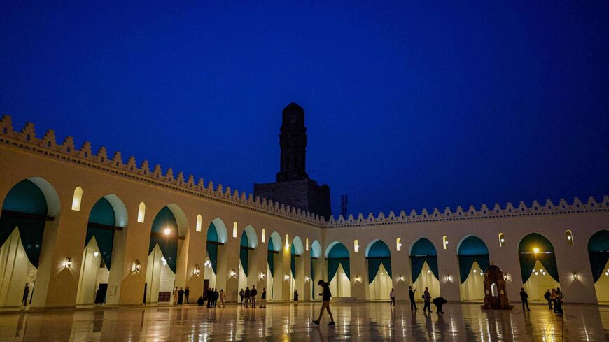 People visit the Al-Hakim bi-Amr Allah Mosque in Cairo, February 27, 2023.