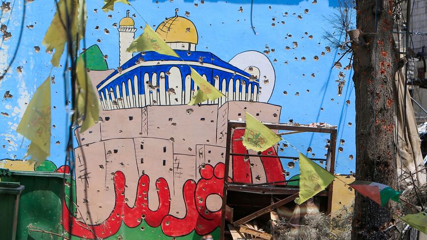 A bullet-ridden mural at the Ain el-Helweh camp, in Lebanon's southern coastal city of Sidon, following the latest flare-up between Fatah and Islamist forces in the camp for Palestinian refugees,on August 4, 2023.