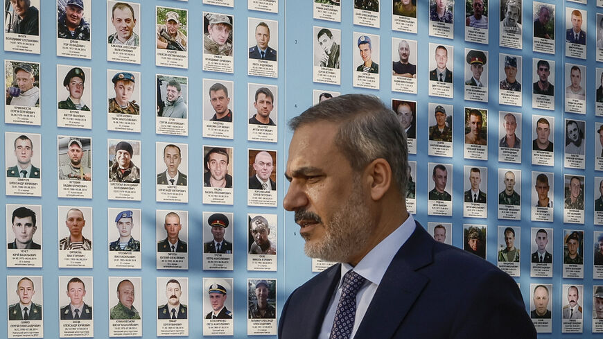 Turkish Foreign Minister Hakan Fidan visits the Memory Wall of Fallen Defenders of Ukraine during his official visit in Kyiv, on August 25, 2023, the Independence Day of Ukraine, amid the Russian invasion of Ukraine. (Photo by GLEB GARANICH / POOL / AFP) (Photo by GLEB GARANICH/POOL/AFP via Getty Images)