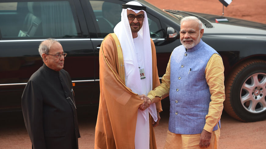 Then-Crown Prince of Abu Dhabi Sheikh Mohammed Bin Zayed Al Nahyan (C) with Indian Prime Minister Narendra Modi (R) and Indian President Pranab Mukherjee (L) before a ceremonial reception at the Indian President's house in New Delhi on Jan. 25, 2017.