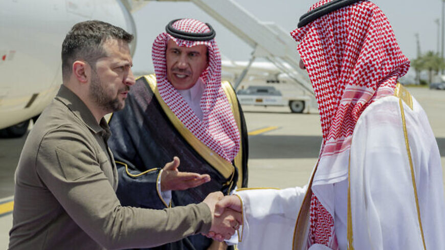 In this photo provided by Saudi Press Agency, SPA, Ukraine's President Volodymyr Zelensky, left, is greeted by Prince Badr Bin Sultan, deputy governor of Mecca, upon his arrival at Jeddah airport, Saudi Arabia, May 19, 2023, to attend the Arab summit. (Saudi Press Agency via AP)
