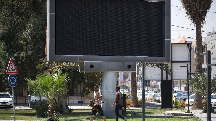 Several screens in Baghdad that usually show advertisements for household goods or political candidates before elections were switched off on Sunday morning