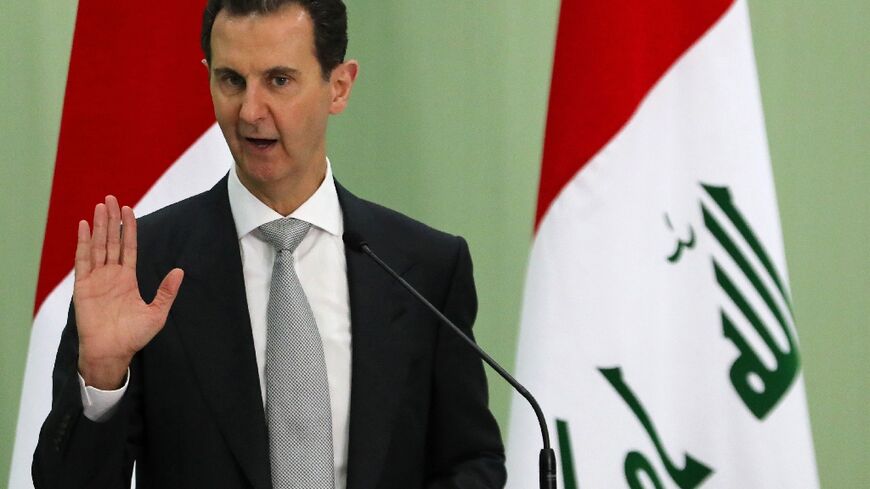 Syria's President Bashar al-Assad speaks during a press conference with Iraq's prime minister in Damascus on July 16, 2023, as Assad's engagement with Middle East countries increases