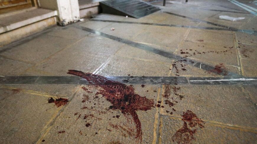 Blood stains the floor after the fatal attack at Iran's Shah Cheragh mausoleum in Shiraz, the capital of Fars province