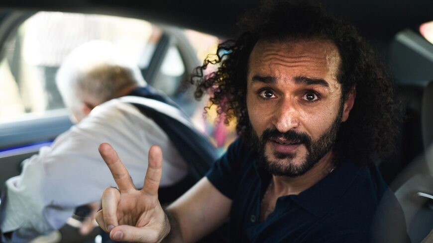 Egyptian activist Ahmed Douma, a leading figure in the country's 2011 uprising who has spent the past decade behind bars, gestures following his release from prison