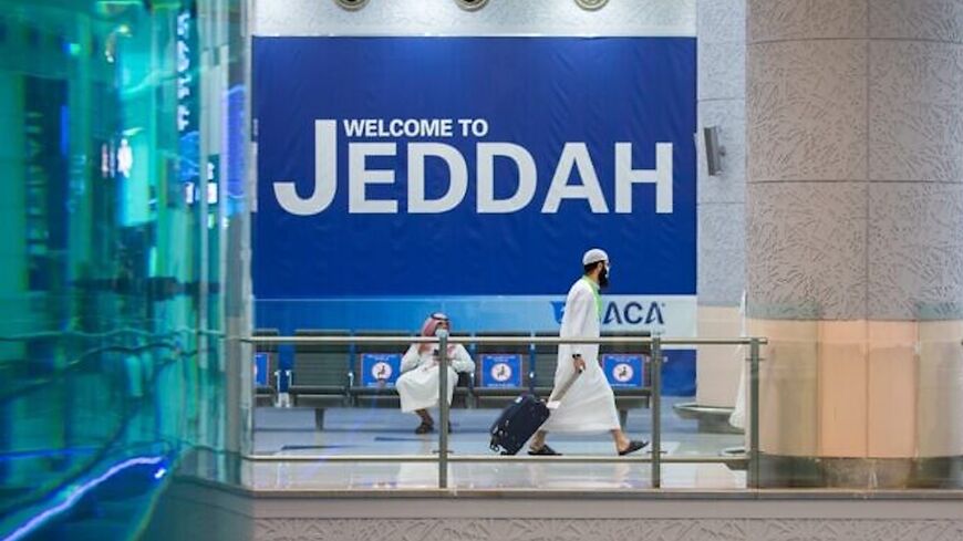 A traveler walking at the Red Sea coastal city of Jeddah's King Abdulaziz International Airport.