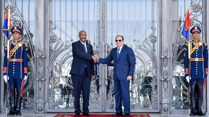 Egyptian President Abdel Fattah al-Sisi (R) receives Sudanese General Abdel Fattah al-Burhan in El Alamein, Aug. 29, 2023.