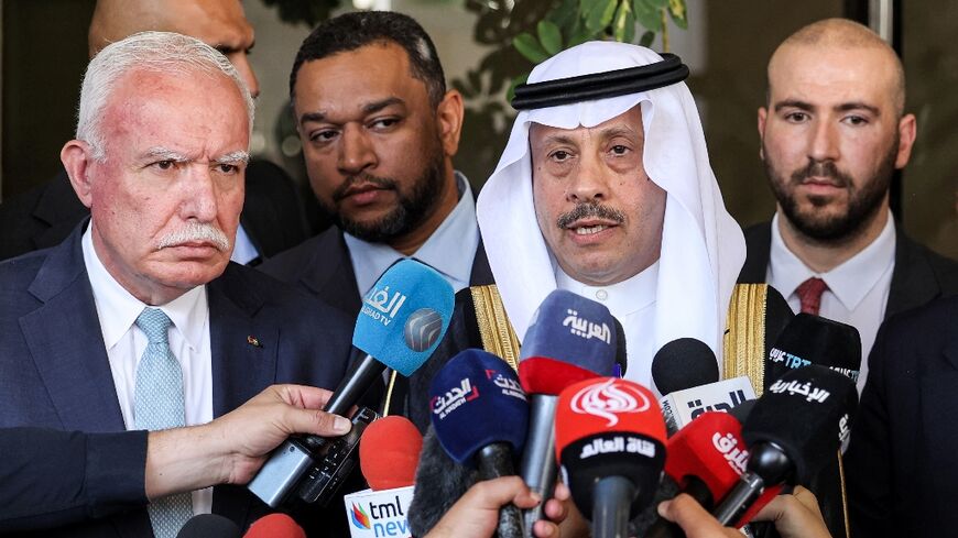 Saudi ambassador Nayef bin Bandar al-Sudairi speaks to journalists, joined by Palestinian foreign minister Riyad al-Maliki, on the left