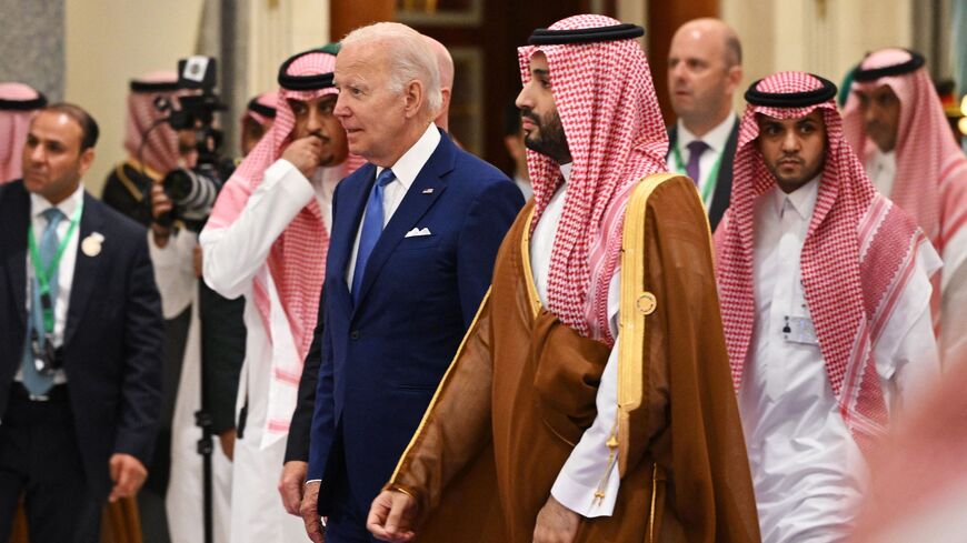 US President Joe Biden (L) and Saudi Crown Prince Mohammed bin Salman (R) arrive for the family photo during the Jeddah Security and Development Summit (GCC+3) at a hotel in Saudi Arabia's Red Sea coastal city of Jeddah on July 16, 2022. 