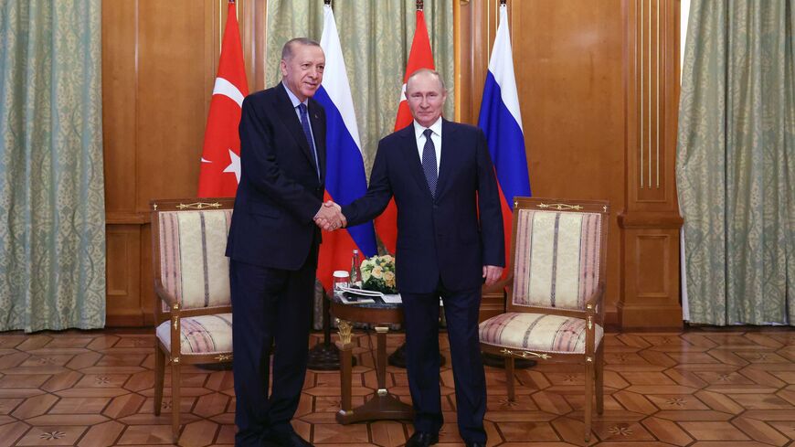 Russian President Vladimir Putin (R) shakes hands with Turkish President Recep Tayyip Erdogan (L) during a meeting in Sochi, on August 5, 2022. (Photo by Vyacheslav Prokofyev and Vyacheslav PROKOFYEV / POOL / AFP) (Photo by VYACHESLAV PROKOFYEV/POOL/AFP via Getty Images)