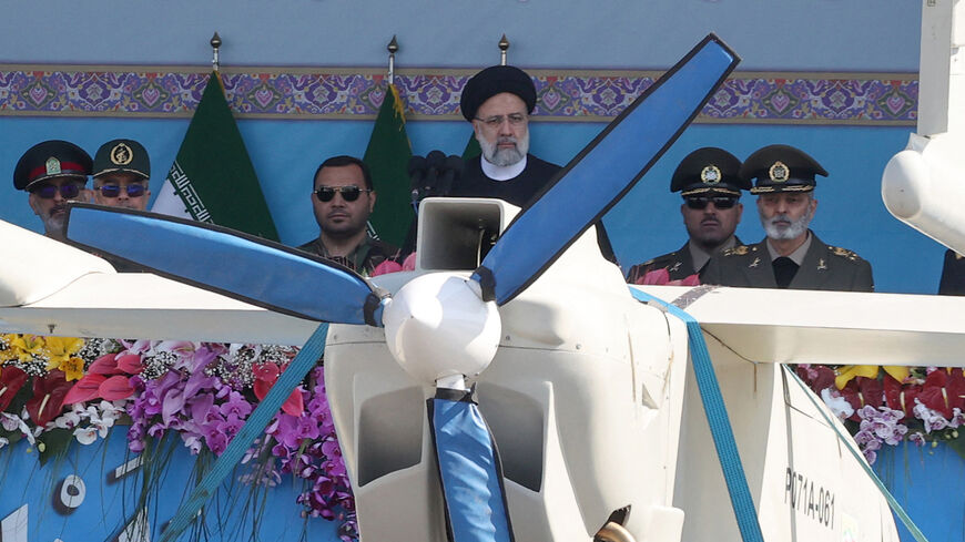 Iran's President Ebrahim Raisi watches combat drones alongside high-ranking officials and commanders during a military parade marking the country's annual army day, Tehran, Iran, April 18, 2023.
