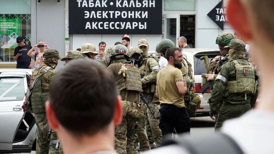 Members of Wagner group inspect a car in a street of Rostov-on-Don, on June 24, 2023. President Vladimir Putin on June 24, 2023 said an armed mutiny by Wagner mercenaries was a "stab in the back" and that the group's chief Yevgeny Prigozhin had betrayed Russia, as he vowed to punish the dissidents. Prigozhin said his fighters control key military sites in the southern city of Rostov-on-Don. (Photo by STRINGER / AFP) (Photo by STRINGER/AFP via Getty Images)