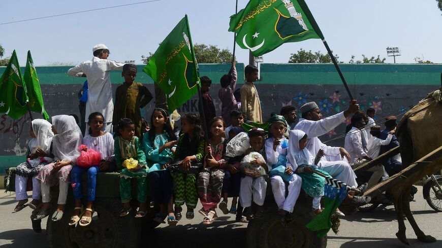 Muslim devotees take part in a rally to celebrate Eid-e-Milad-un-Nabi, which marks the birth anniversary of the Prophet Mohammad, in Karachi on September 29, 2023. (Photo by Asif HASSAN / AFP) (Photo by ASIF HASSAN/AFP via Getty Images)