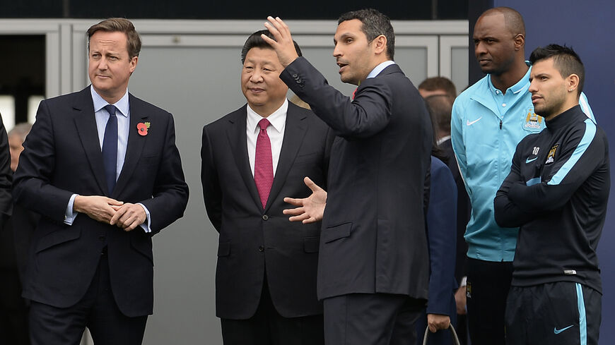 Britain's Prime Minister David Cameron, China's President Xi Jinping, Manchester City chairman Khaldoon Al Mubarak, head of the Elite Development Patrick Vieira and striker Sergio Kun Aguero during a visit to the City Football Academy on October 23, 2015 in Manchester, England. The President of the People's Republic of China, Xi Jinping and his wife, Madame Peng Liyuan, are paying a State Visit to the United Kingdom as guests of The Queen. They will stay at Buckingham Palace and undertake engagements in Lon