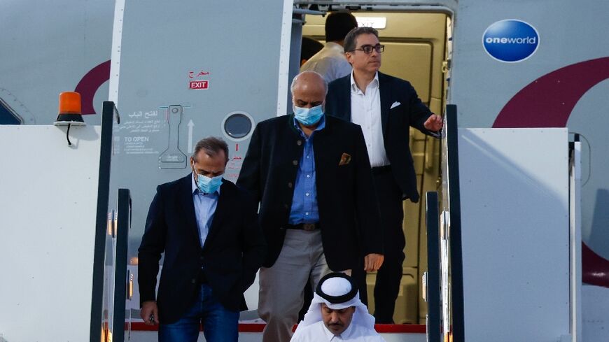 US citizens Siamak Namazi, Emad Sharqi and Morad Tahbaz disembark from a Qatari jet upon their arrival at Doha International Airport