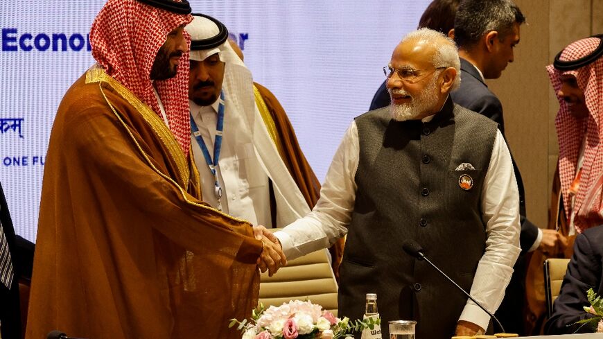 Indian Prime Minister Narendra Modi shakes hands with Saudi Arabia's Crown Prince Mohammed bin Salman (L) at the G20 Leaders' Summit, where the two joined other world leaders in unveiling plans to create a modern-day Spice Route to help boost trade