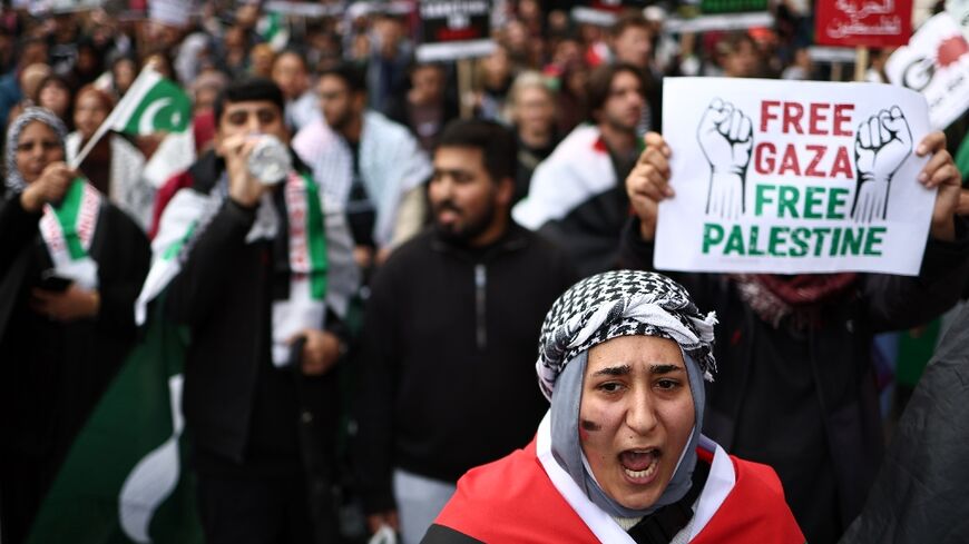 People take part in a 'March For Palestine' to 'demand an end to the war on Gaza'