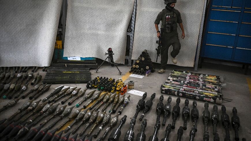 The Israeli military displays weapons recovered from Hamas militants after the bloody attacks of October 7, including some it says were manufactured in Iran or North Korea