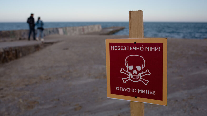 A view of the sign that reads "Caution: mines" on the beach on April 25, 2022, in Odesa, Ukraine.