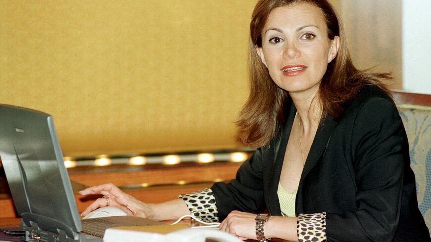 Lebanese Broadcast Corporation International (LBCI) television show host Giselle Khoury sits at her desk 02 May 2001 during a visit to Dubai. Khoury, who runs the "Hiwaar al-Umr", or "Life Dialogue", general affairs show is noted for her engaging interviewing skills. EDITORS NOTE: Khoury's left eye is naturally lighter than the right one. (Photo by EDDY PADO / AFP) (Photo by EDDY PADO/AFP via Getty Images)