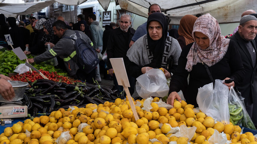 People shop at a local street market, Istanbul, Turkey, May 3, 2023.