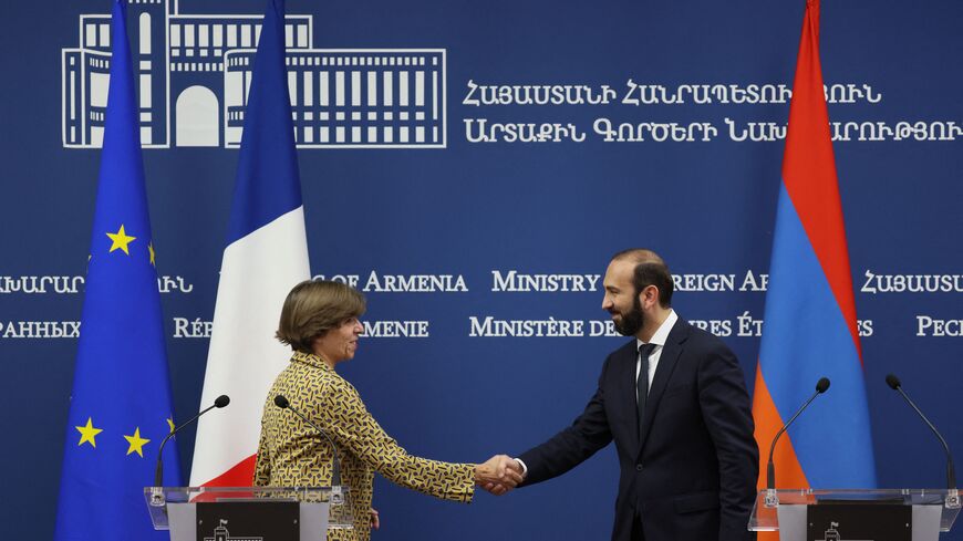 French Foreign Minister Catherine Colonna and her Armenian counterpart Ararat Mirzoyan shake hands at the end of a joint press conference following their talks in Yerevan on October 3, 2023. (Photo by ALAIN JOCARD / AFP) (Photo by ALAIN JOCARD/AFP via Getty Images)