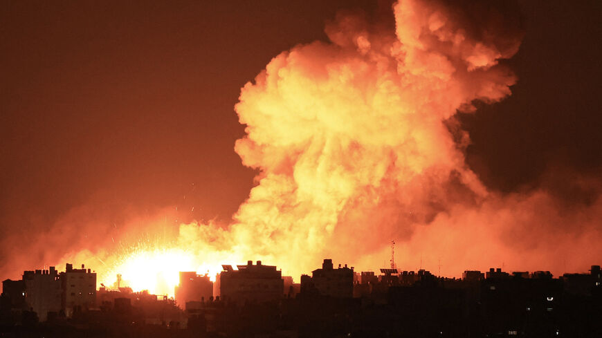Explosions illuminate the sky during Israeli strikes on Gaza City on October 10, 2023. Israel said it recaptured Gaza border areas from Hamas as the war's death toll passed 3,000 on October 10, the fourth day of gruelling fighting since the Islamists launched a surprise attack. (Photo by MAHMUD HAMS / AFP) (Photo by MAHMUD HAMS/AFP via Getty Images)