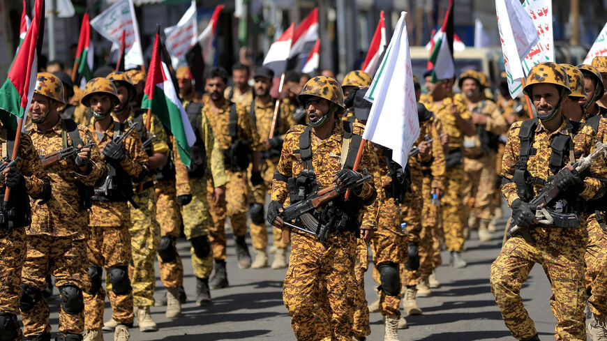 Forces loyal to Yemen's Houthi rebels hold up Palestinian flags as they march in a show of solidarity with the Palestinians, Sanaa, Yemen, Oct. 15, 2023.