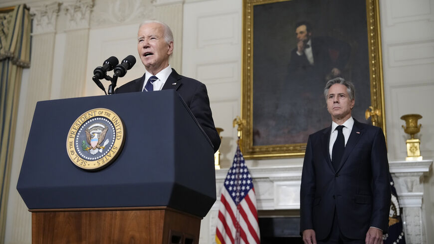  US President Joe Biden, joined by Secretary of State Antony Blinken, delivers remarks on the Hamas terrorist attacks in Israel in the State Dining Room of the White House, Washington, Oct. 10, 2023.