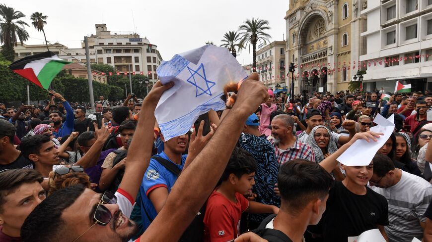 People chant slogans during a protest supporting the Palestinian people following Friday Noon prayers in the Tunisian capital Tunis on October 20, 2023, amid the ongoing battles between Israel and Hamas. 