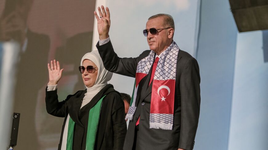 Turkish President Recep Tayyip Erdogan and his wife, Emine Erdogan, attend a rally in solidarity with Palestinians in Istanbul on Oct. 28, 2023. 