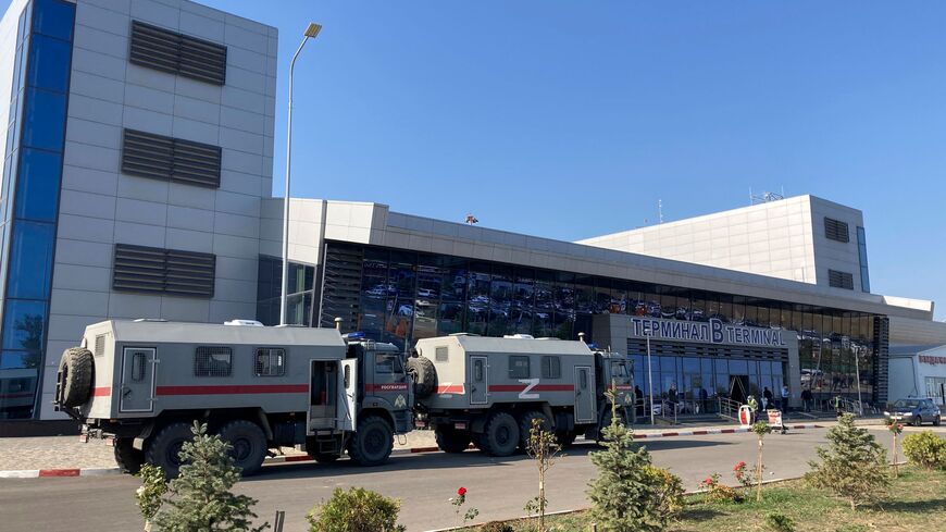 This photograph shows Russian National Guard (Rosgvardiya) vans parked at the airport in Makhachkala on October 30, 2023. Russian police on October 30, 2023 said they had arrested 60 people suspected of storming an airport in the Muslim-majority Caucasus republic of Dagestan, seeking to attack Jewish passengers coming from Israel. (Photo by STRINGER / AFP) (Photo by STRINGER/AFP via Getty Images)