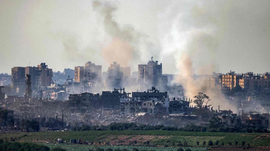 This picture taken on Oct. 31, 2023 from a position along the border with the Gaza Strip in southern Israel shows smoke plumes billowing during Israeli bombardment amid ongoing battles between Israel and the Palestinian Hamas movement.