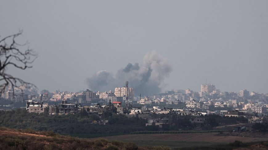 Plumes of smoke billow over the northern Gaza Strip following Israeli military strikes, amid the ongoing battles between Israel and the Palestinian group Hamas