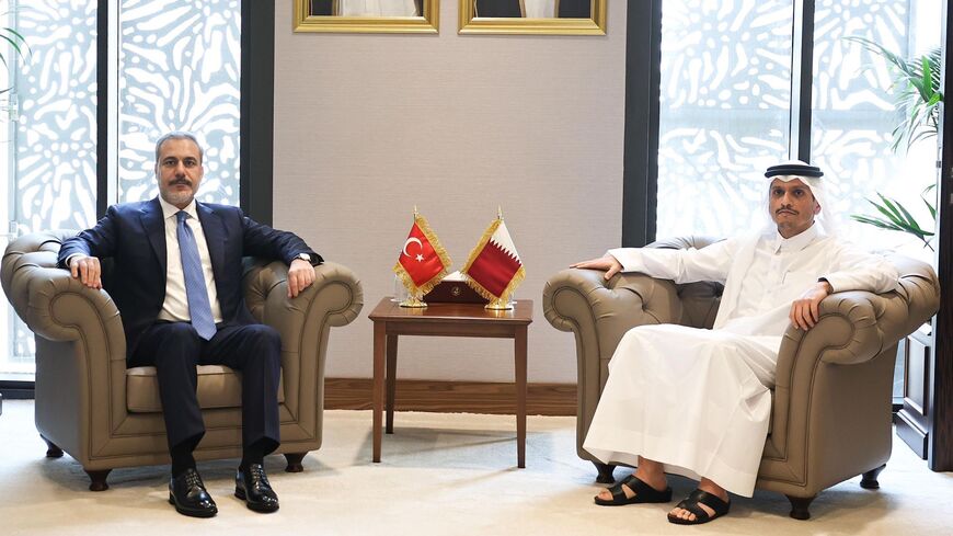 Turkish Foreign Minister Hakan Fidan (L) meets with Qatari Prime Minister and Foreign Minister Sheikh Mohammed bin Abdulrahman Al Thani in Doha, Oct. 25, 2023.