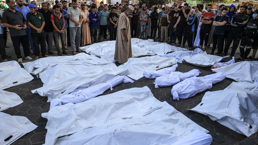 Bodies wrapped in shrouds at the Shuhada Al-Aqsa hospital in Deir Balah in the central Gaza Strip on November 6, 2023