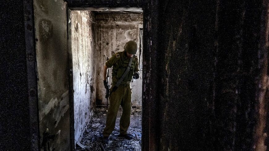 The stench of death still pervades charred homes more than a month after Israel's Kfar Aza was stormed by Hamas gunmen