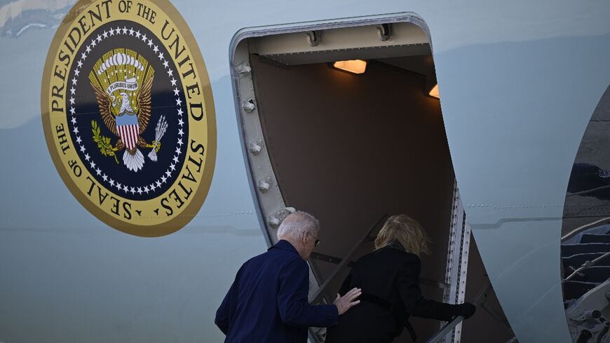 US President Joe Biden and US First Lady Jill Biden walk to board Air Force One at Joint Base Andrews