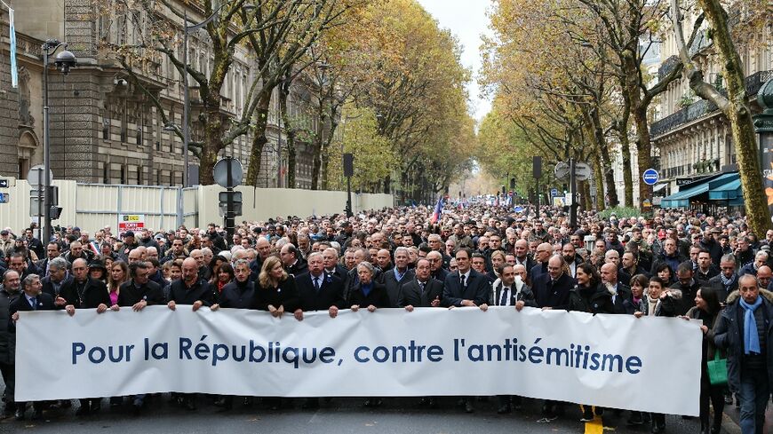 Leading politicians walked at the front of the march with a banner reading 'for the republic, against anti-Semitism'