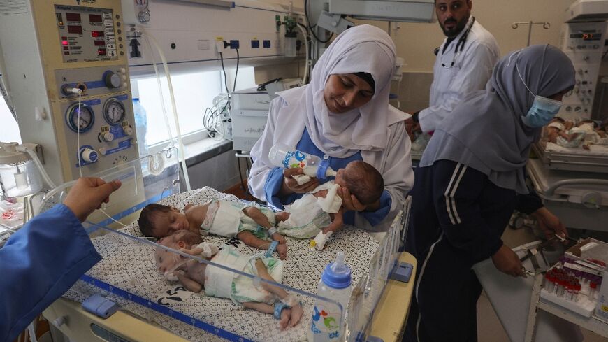 Palestinian medics care for premature babies evacuated from Al-Shifa hospital to the Emirates hospital in Rafah, the southern Gaza Strip