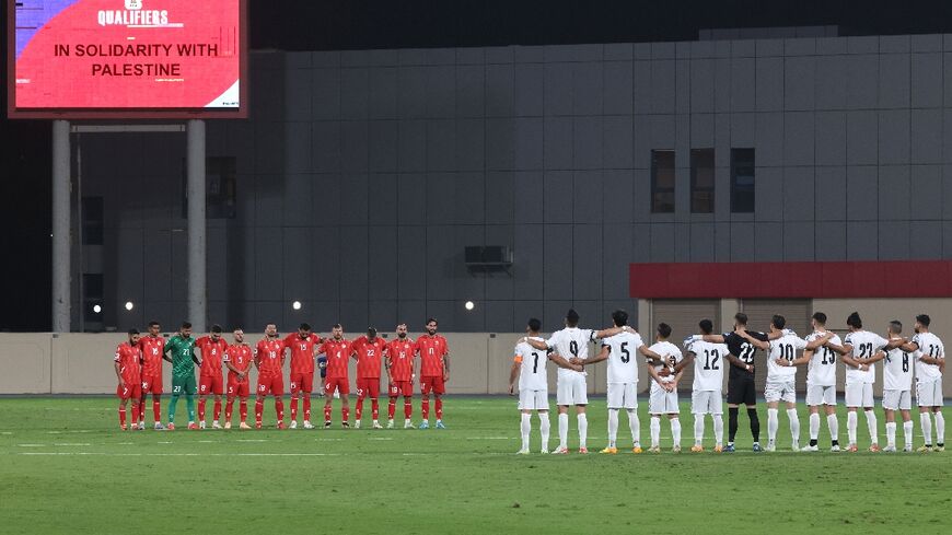 Lebanon and Palestine hold a moment's silence for the victims of the current conflict ahead of their World Cup qualifier in Sharjah