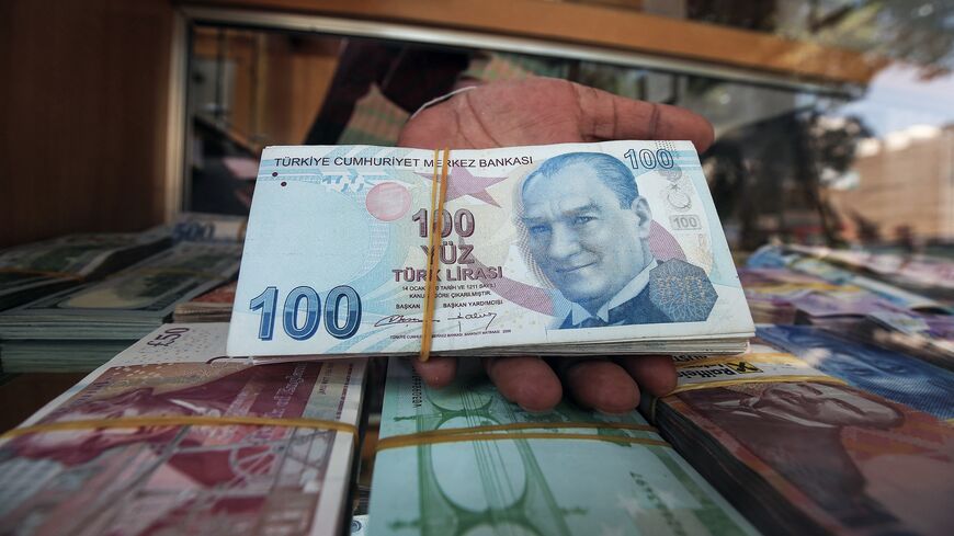 One-hundred Turkish lira notes on display at a currency exchange in Kuwait City, August 12, 2018.