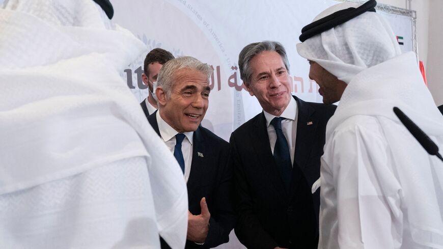 Israel's Foreign Minister Yair Lapid (2nd L) and U. Secretary of State Antony Blinken (2nd R) chat with Bahrain's Foreign Minister Abdullatif bin Rashid al-Zayani (R) and United Arab Emirates' Foreign Minister Sheikh Abdullah bin Zayed Al Nahyan (L), in Sde Boker, Israel on March 28, 2022. - Blinken and the top diplomats of Israel and four Arab states held a landmark meeting to discuss issues from the Iran nuclear negotiations to the global shockwaves of Russia's invasion of Ukraine. (Photo by Jacquelyn Mar