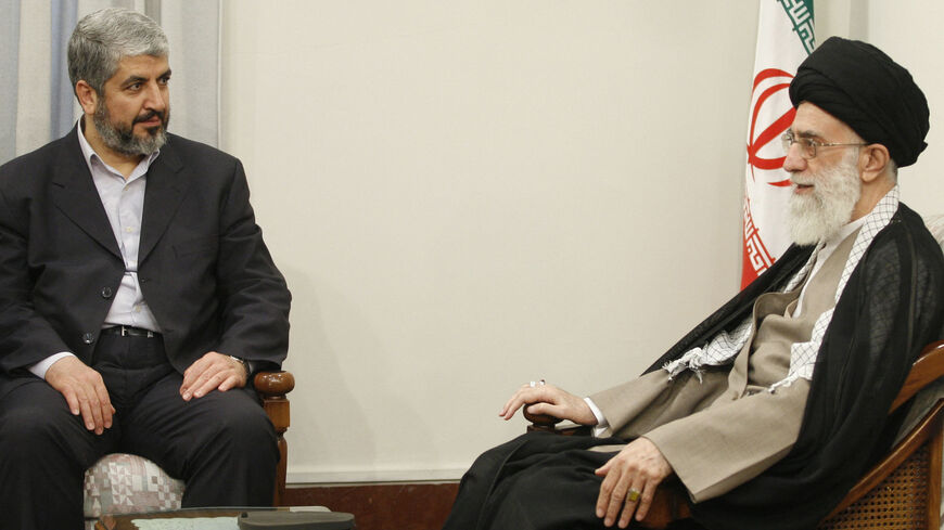 Iran's Supreme Leader Ayatollah Ali Khamenei (R) meets with exiled leader of the Palestinian Islamist Hamas movement Khaled Meshaal.