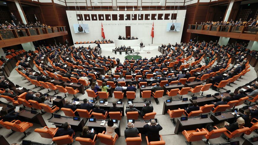 Turkish President Recep Tayyip Erdogan (C) addresses parliament to mark the opening of the new legislative year.