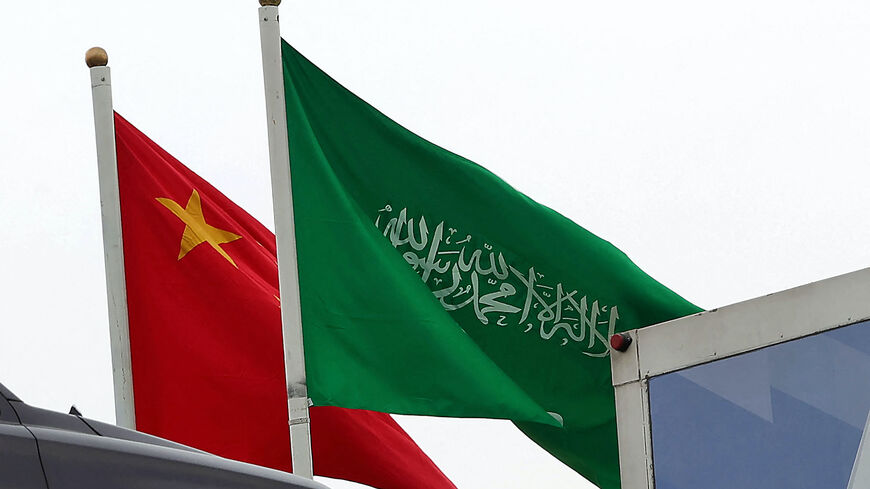 A picture taken on December 7, 2022 in Riyadh, shows the Chinese and the Saudi flags adorning a street ahead of the Chinese president's visit to the Saudi capital. 