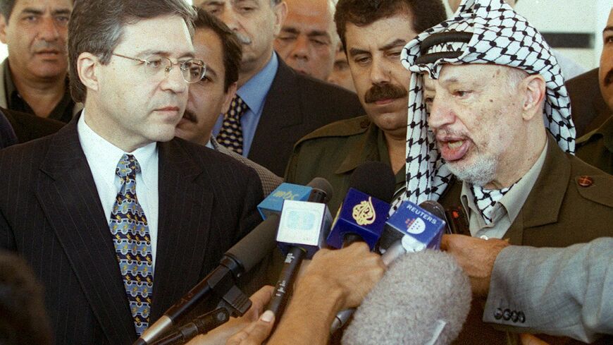 Palestinian leader Yasser Arafat and Yossi Beilin (L) after meeting in Gaza City 06 September 1999.