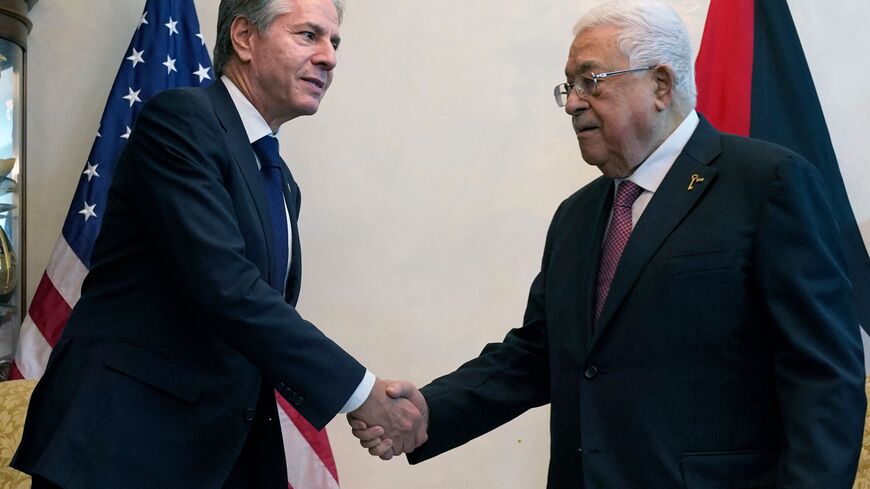 US Secretary of State Antony Blinken (L) shakes hands with Palestinian president Mahmud Abbas during their meeting in Jordan's capital Amman on October 13, 2023. Blinken began on October 12 a tour of Arab capitals as he seeks to build pressure on Hamas while Israel readies a likely massive offensive on the Gaza Strip following the militants' attacks. (Photo by Jacquelyn Martin / POOL / AFP) (Photo by JACQUELYN MARTIN/POOL/AFP via Getty Images)