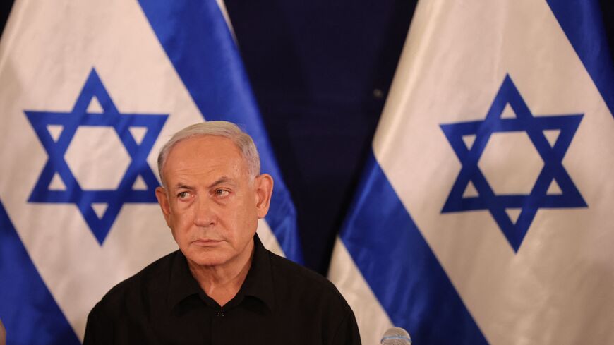 Israeli Prime Minister Benjamin Netanyahu attends a press conference in the Kirya military base in Tel Aviv on October 28, 2023 amid ongoing battles between Israel and the Palestinian group Hamas.